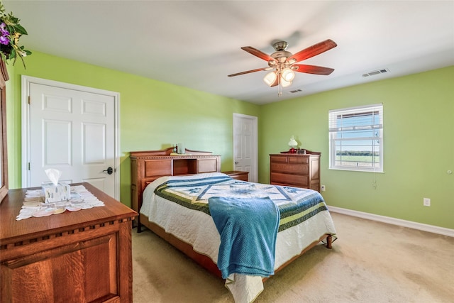 4379 County Road 4804, Wolfe City, TX 75449 - bedroom featuring light colored carpet, baseboards, and a ceiling fan