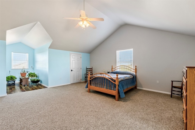 bedroom with multiple windows, ceiling fan, carpet floors, and vaulted ceiling