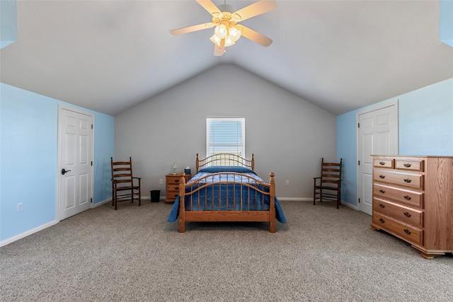 bedroom with ceiling fan, carpet floors, and lofted ceiling