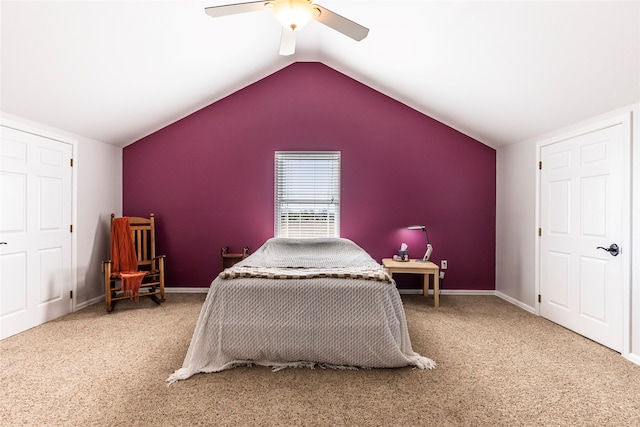 bedroom featuring ceiling fan, carpet floors, and vaulted ceiling