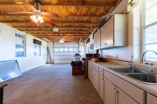 4379 County Road 4804, Wolfe City, TX 75449 - garage featuring a sink and ceiling fan