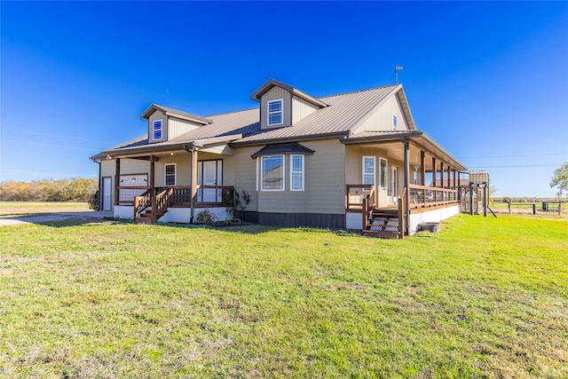 view of front of house with a front lawn, a porch, and a garage