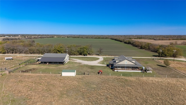 birds eye view of property with a rural view