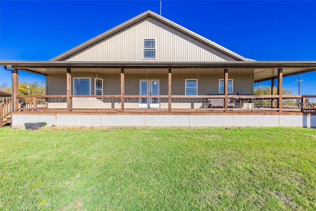 back of property with a yard
