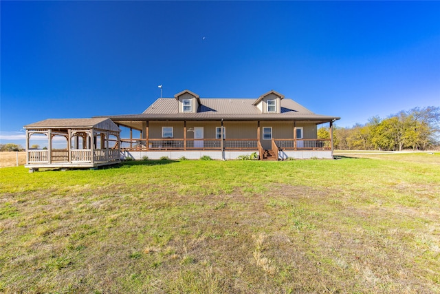 rear view of house with a yard