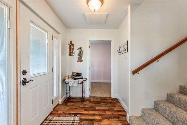 4379 County Road 4804, Wolfe City, TX 75449 - entryway featuring stairs, dark wood finished floors, and baseboards