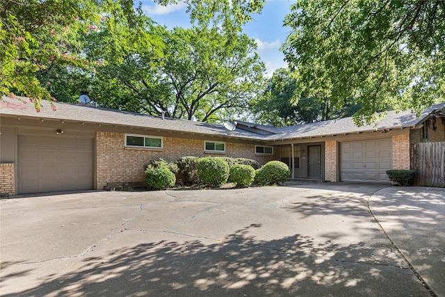 ranch-style home featuring a garage