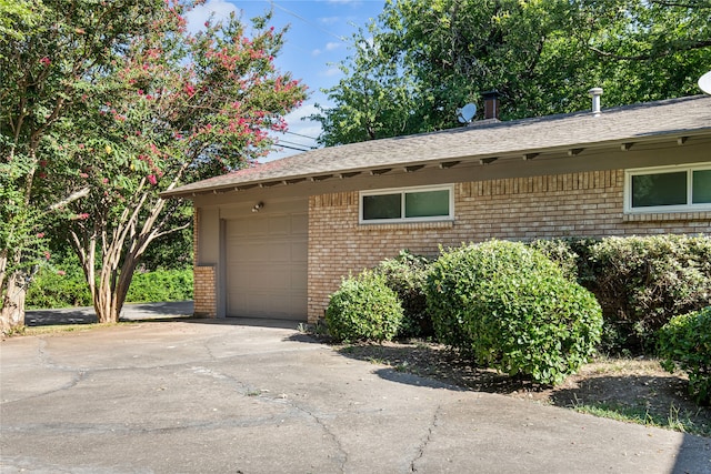 view of side of property with a garage