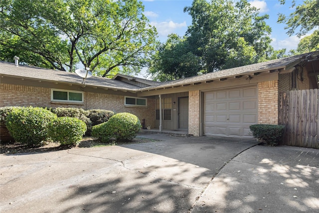 ranch-style house featuring a garage