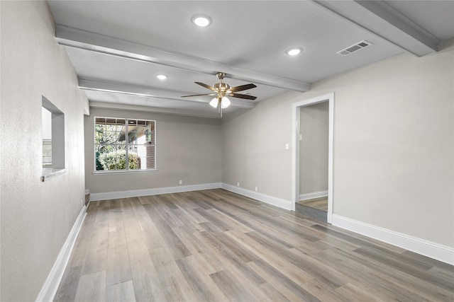 unfurnished room with ceiling fan, beam ceiling, and light wood-type flooring