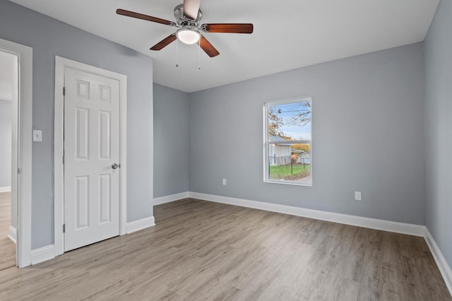 unfurnished bedroom featuring ceiling fan and light wood-type flooring