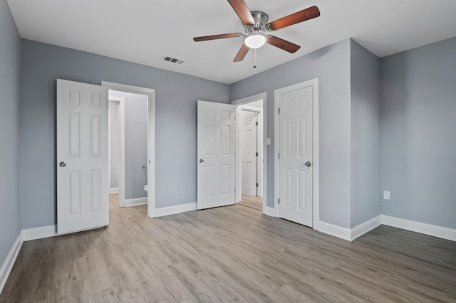 unfurnished bedroom with ceiling fan and light hardwood / wood-style floors