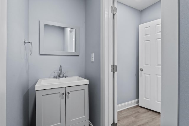 bathroom featuring vanity and hardwood / wood-style flooring