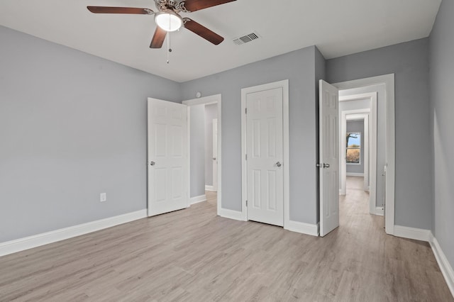 unfurnished bedroom with light hardwood / wood-style flooring and ceiling fan