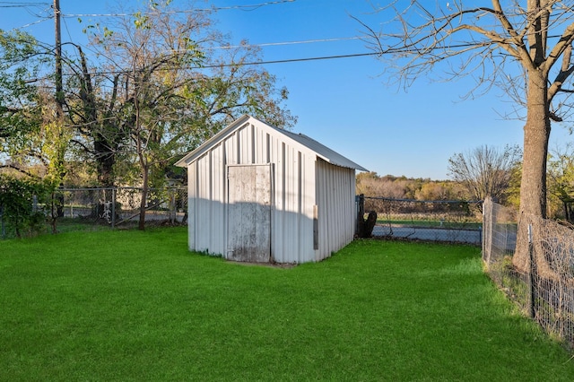 view of outbuilding with a lawn