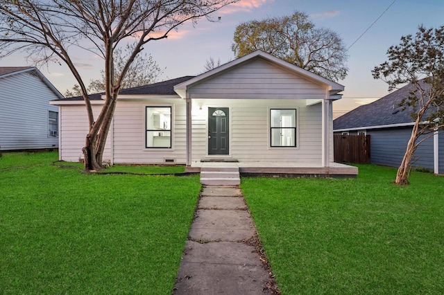 bungalow-style house with a yard