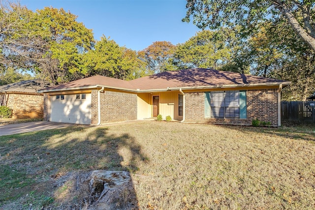 ranch-style house with a front yard and a garage