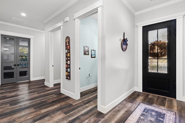 foyer with ornamental molding, dark wood-type flooring, and french doors