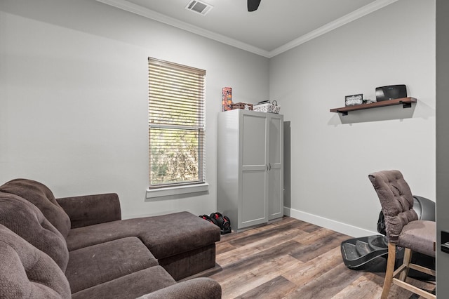 home office featuring crown molding, ceiling fan, and wood-type flooring