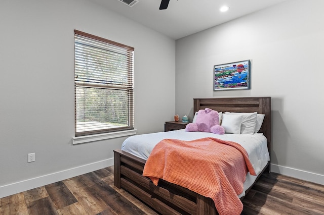 bedroom featuring dark hardwood / wood-style flooring and ceiling fan