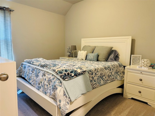 carpeted bedroom featuring vaulted ceiling