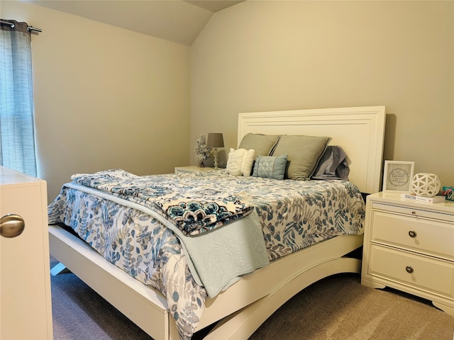 carpeted bedroom featuring lofted ceiling