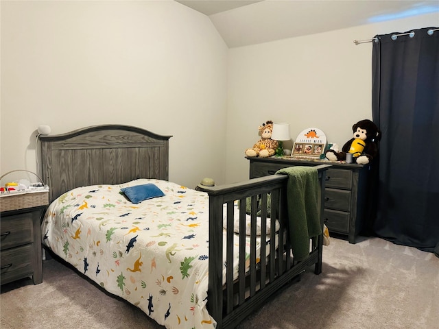 bedroom featuring light carpet and vaulted ceiling