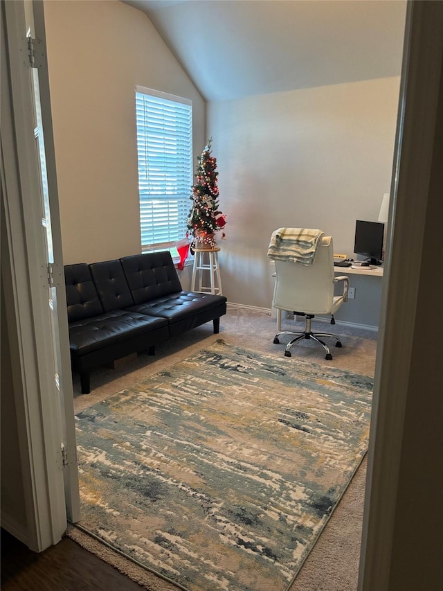 office space with lofted ceiling, baseboards, and carpet floors