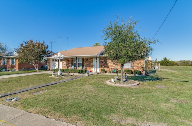 view of front of property featuring a garage and a front lawn