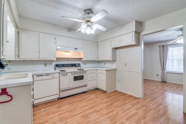 kitchen featuring sink, white cabinets, ceiling fan, white appliances, and light hardwood / wood-style flooring