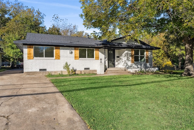 ranch-style house with a front lawn