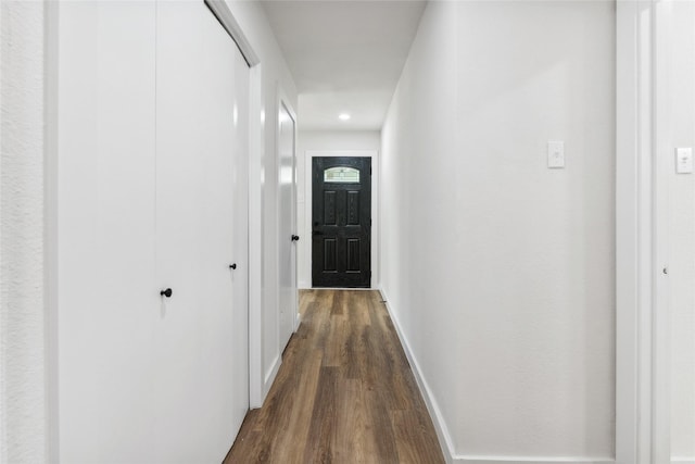 corridor with dark wood-type flooring