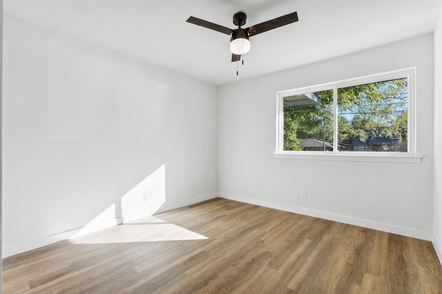 unfurnished room featuring ceiling fan and light wood-type flooring