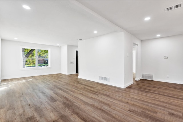 empty room with wood-type flooring