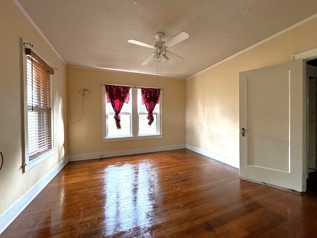 spare room with crown molding, wood-type flooring, and ceiling fan