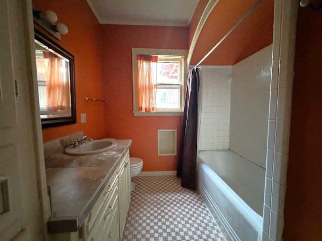 full bathroom featuring vanity, shower / bathtub combination with curtain, and toilet