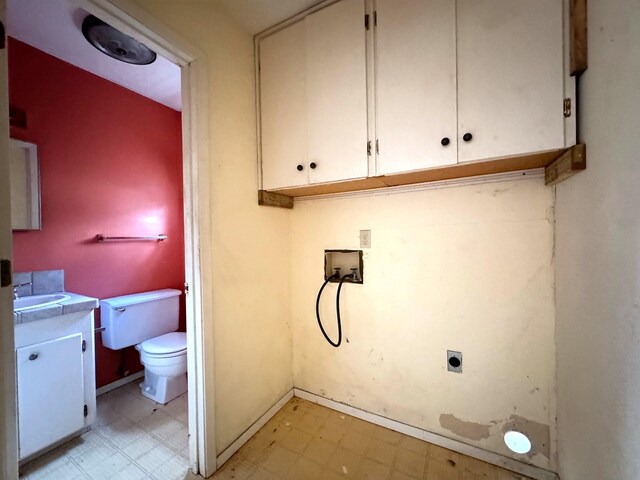 laundry area with cabinets, hookup for a washing machine, sink, and electric dryer hookup