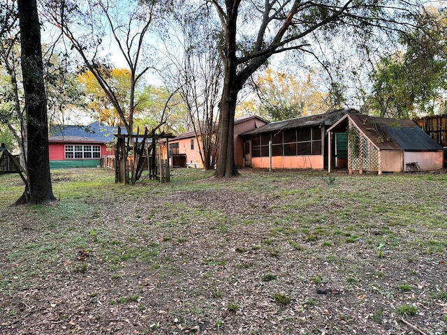 view of yard with a sunroom