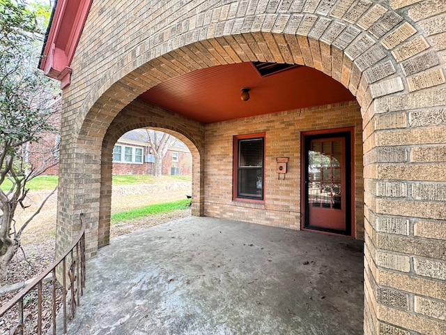 doorway to property with a patio