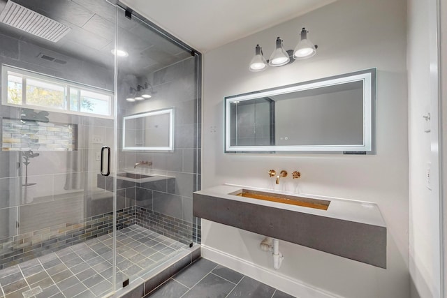 bathroom featuring tile patterned flooring and a shower with door