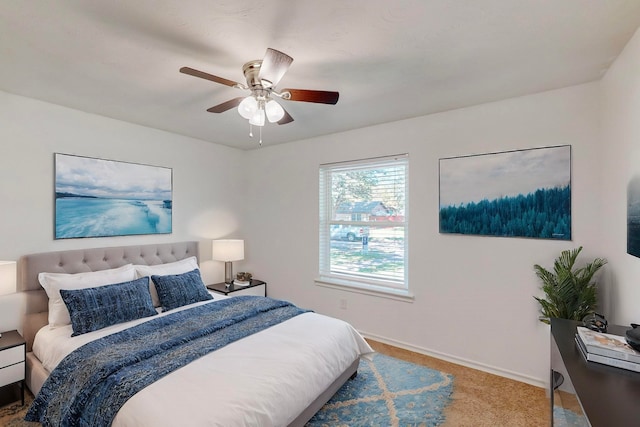 carpeted bedroom featuring ceiling fan