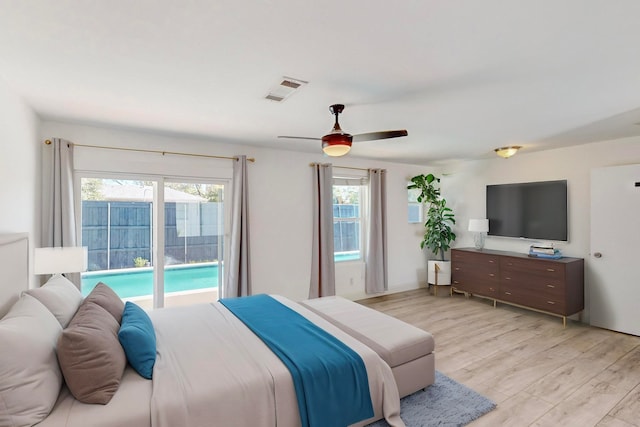 bedroom with access to exterior, ceiling fan, and light hardwood / wood-style flooring