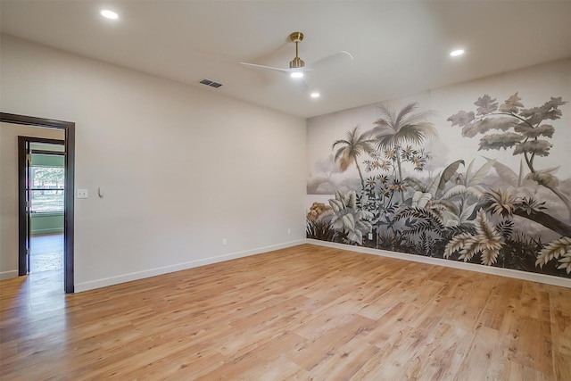 empty room with light wood-type flooring and ceiling fan