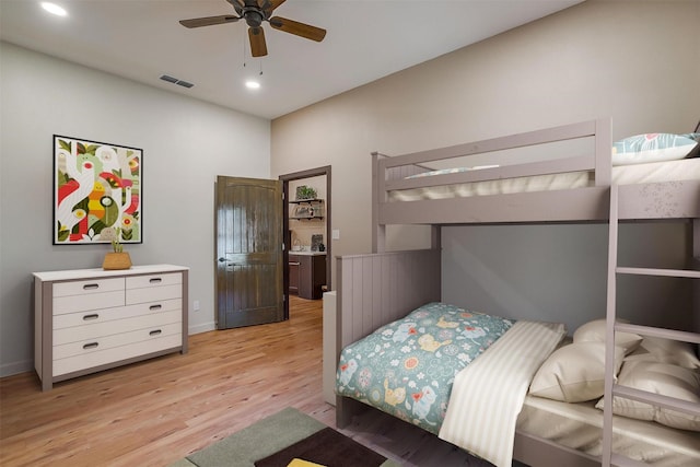 bedroom with ceiling fan and light wood-type flooring