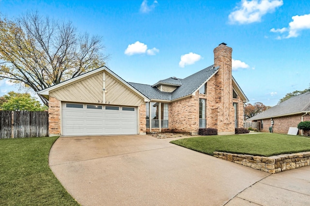 view of front property featuring a garage and a front lawn