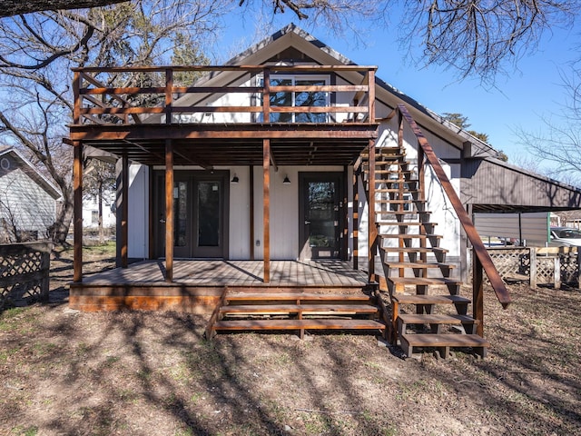 rear view of house featuring a deck