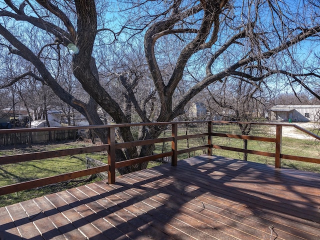 wooden terrace with a yard