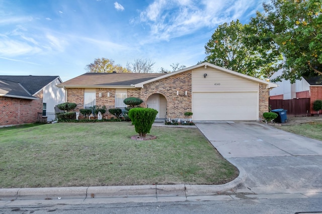 view of front of home with a garage, brick siding, driveway, and a front lawn