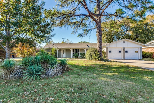 ranch-style home with a front yard and a garage