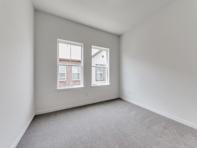 empty room featuring light carpet